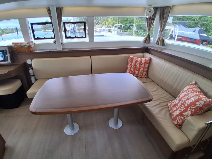Paper Doll Yacht Photos Pics Interior of 2019 Lagoon 450 F yacht with cozy seating and decorative pillows.