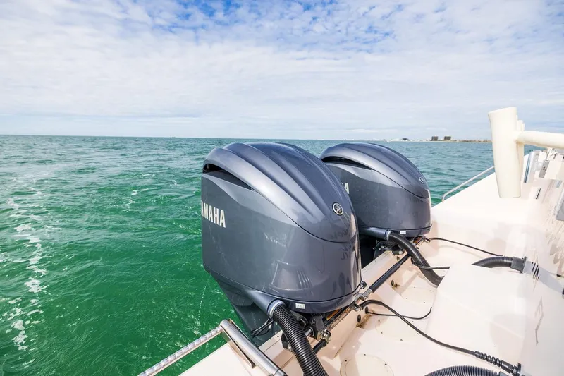  Yacht Photos Pics 2014 Grady-White Canyon 336 boat with twin Yamaha outboard engines on open water.