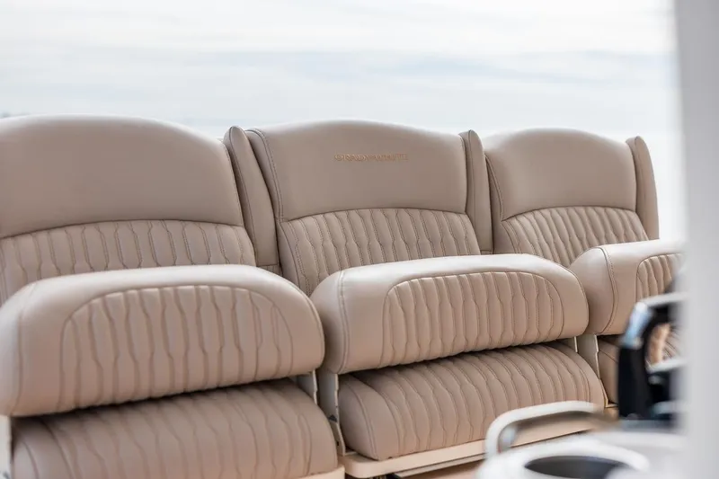  Yacht Photos Pics Luxurious seating on 2014 Grady-White Canyon 336 boat, featuring plush beige upholstery.