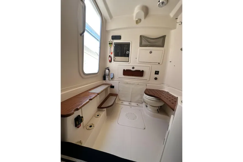  Yacht Photos Pics 2014 Grady-White Canyon 336 boat interior with seating and storage.