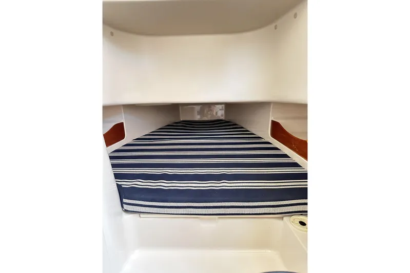  Yacht Photos Pics 2014 Grady-White Canyon 336 cabin interior with striped cushion.