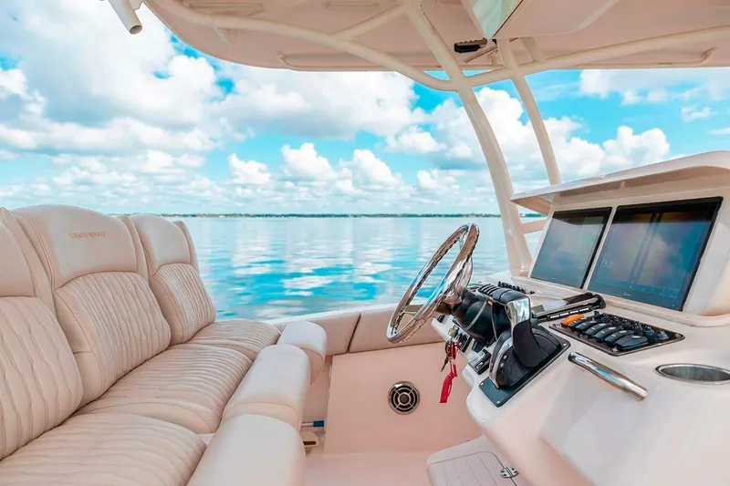  Yacht Photos Pics 2014 Grady-White Canyon 336 boat interior with plush seating and advanced navigation system.