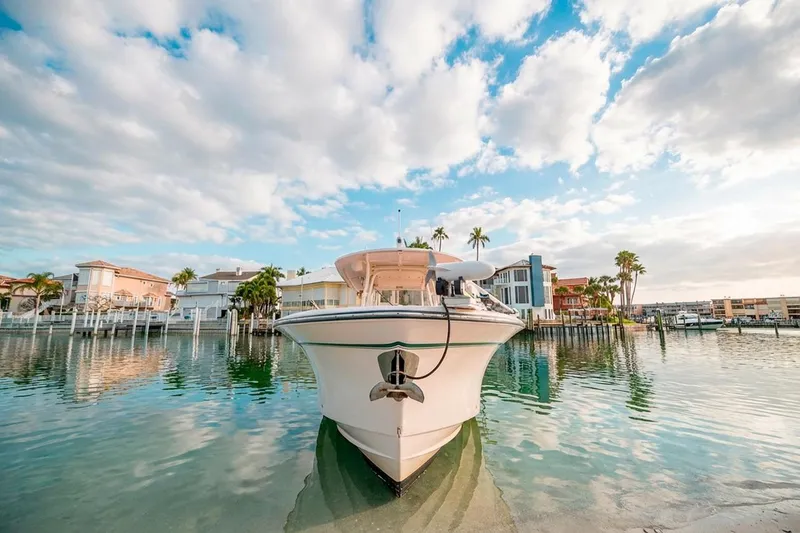  Yacht Photos Pics 2014 Grady-White Canyon 336 boat docked in scenic waterfront setting.