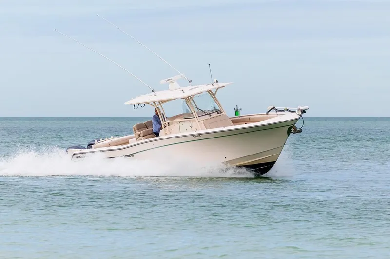  Yacht Photos Pics 2014 Grady-White Canyon 336 boat cruising on open water.