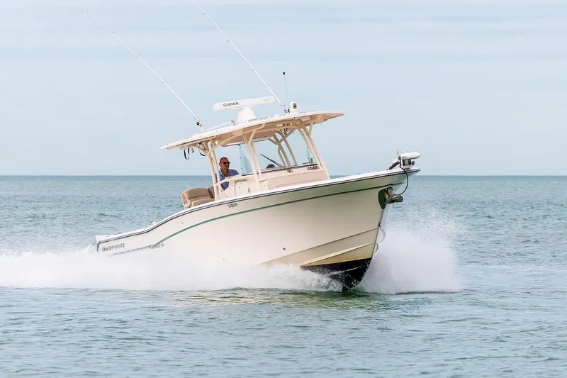  Yacht Photos Pics 2014 Grady-White Canyon 336 boat cruising on open water.