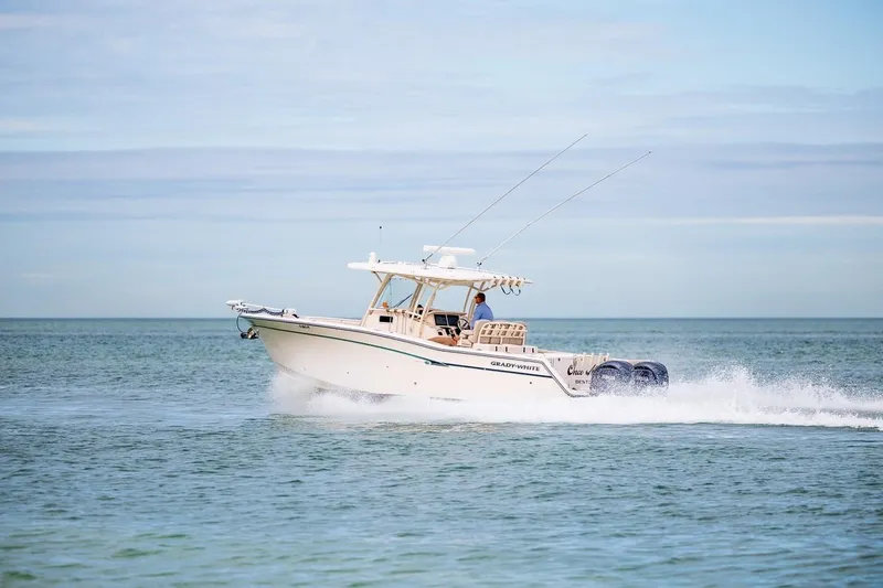  Yacht Photos Pics 2014 Grady-White Canyon 336 boat cruising on open water.