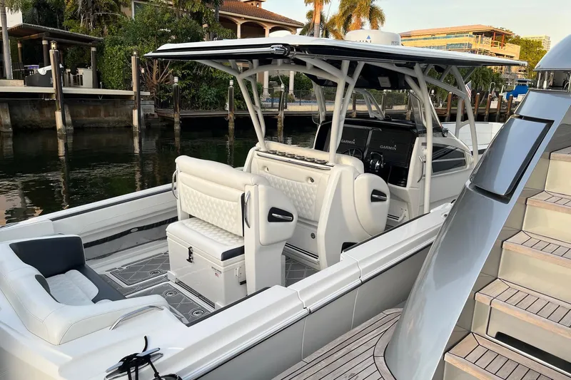  Yacht Photos Pics 2019 Nor-Tech 390 Sport Center Console boat docked, featuring sleek design and modern amenities.