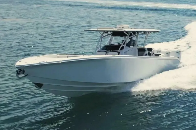  Yacht Photos Pics 2019 Nor-Tech 390 Sport Center Console boat cruising on open water.