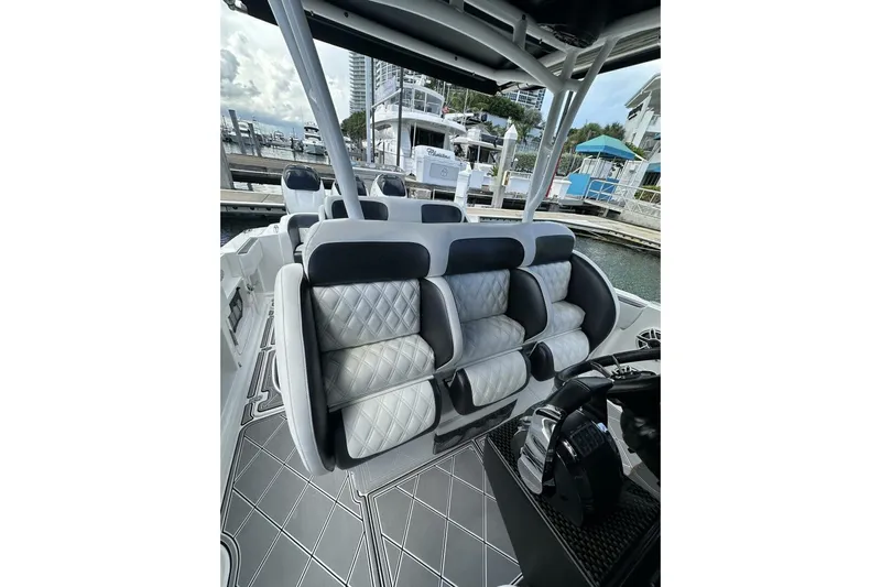  Yacht Photos Pics 2019 Nor-Tech 390 Sport Center Console with luxurious seating at a marina.