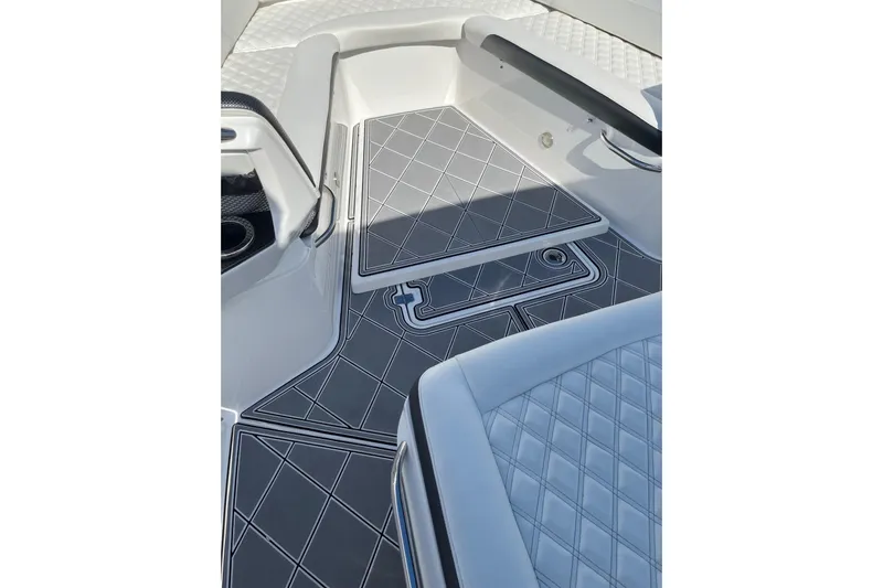  Yacht Photos Pics 2019 Nor-Tech 390 Sport Center Console interior with diamond-patterned flooring and seating.