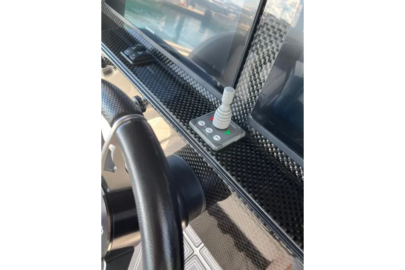  Yacht Photos Pics 2019 Nor-Tech 390 Sport Center Console dashboard with joystick and carbon fiber finish.