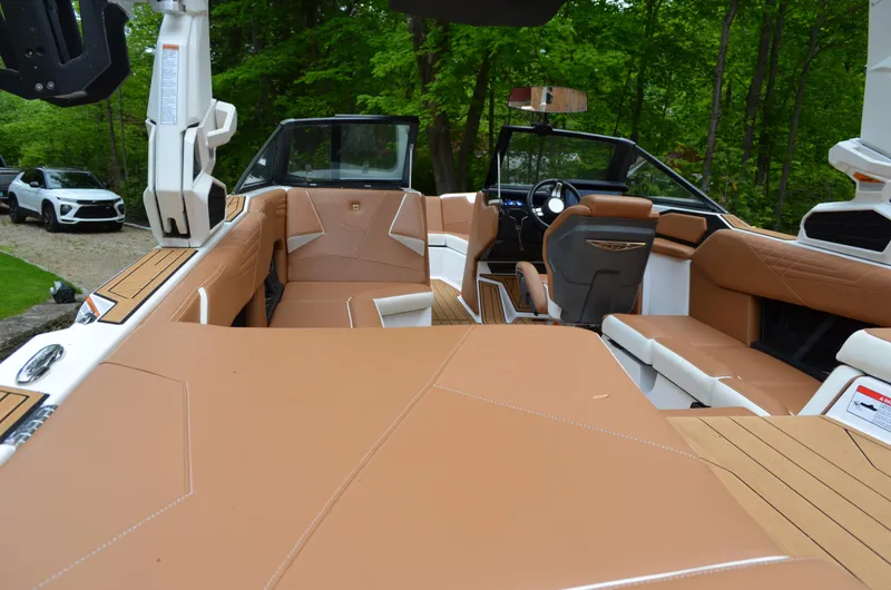  Yacht Photos Pics 2023 Nautique Super Air Nautique S23 interior with tan seating and modern design.