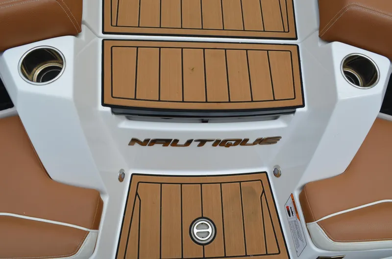  Yacht Photos Pics 2023 Nautique Super Air Nautique S23 boat interior with teak accents and cup holders.