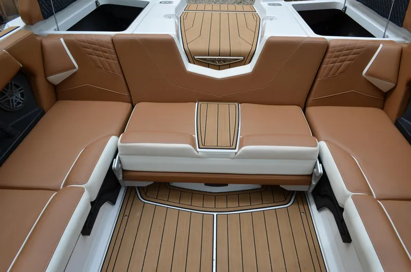  Yacht Photos Pics 2023 Nautique Super Air Nautique S23 interior with tan and white seating.