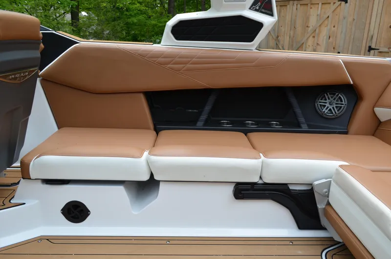  Yacht Photos Pics 2023 Nautique Super Air Nautique S23 interior with tan and white seating.