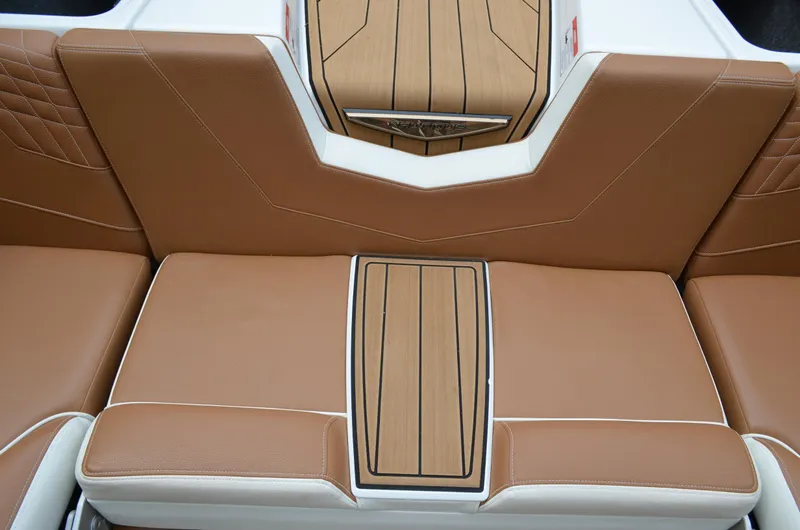  Yacht Photos Pics 2023 Nautique Super Air Nautique S23 interior with tan leather seating and wood accents.