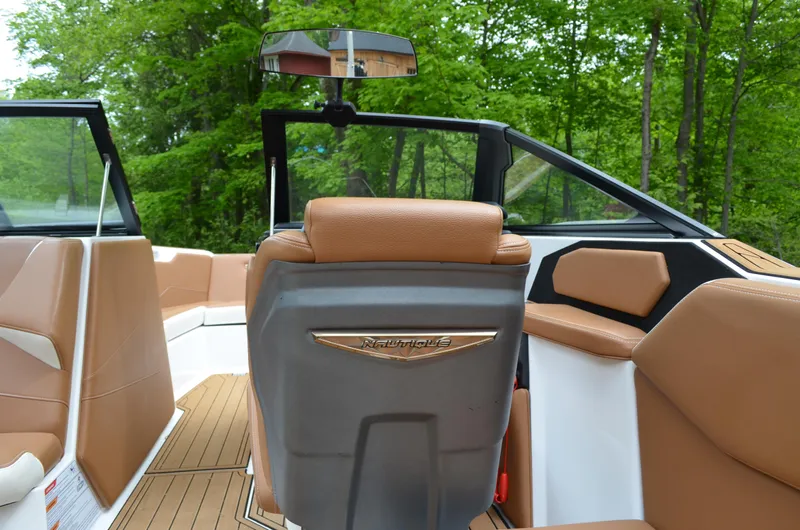  Yacht Photos Pics 2023 Nautique Super Air Nautique S23 interior with tan seating and sleek design.