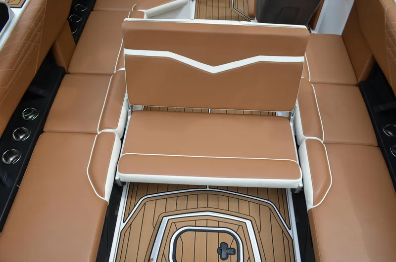  Yacht Photos Pics 2023 Nautique Super Air Nautique S23 interior with tan seating and teak flooring.