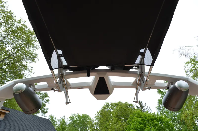  Yacht Photos Pics 2023 Nautique Super Air Nautique S23 boat tower with speakers and canopy, viewed from below.