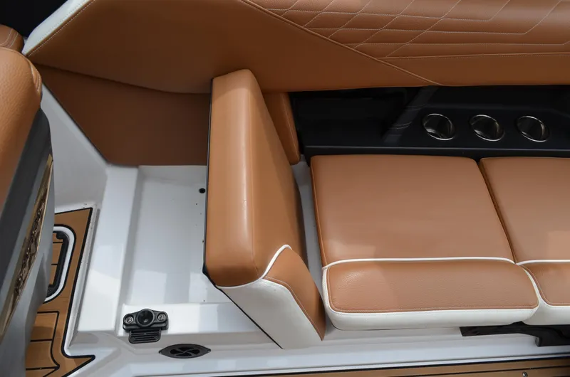  Yacht Photos Pics 2023 Nautique Super Air Nautique S23 interior with tan leather seating and cup holders.