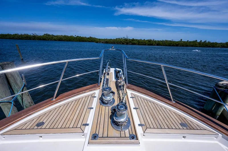 Pivot Yacht Photos Pics 2013 Marlow Explorer Enclosed Bridge (CB) yacht bow on calm water.