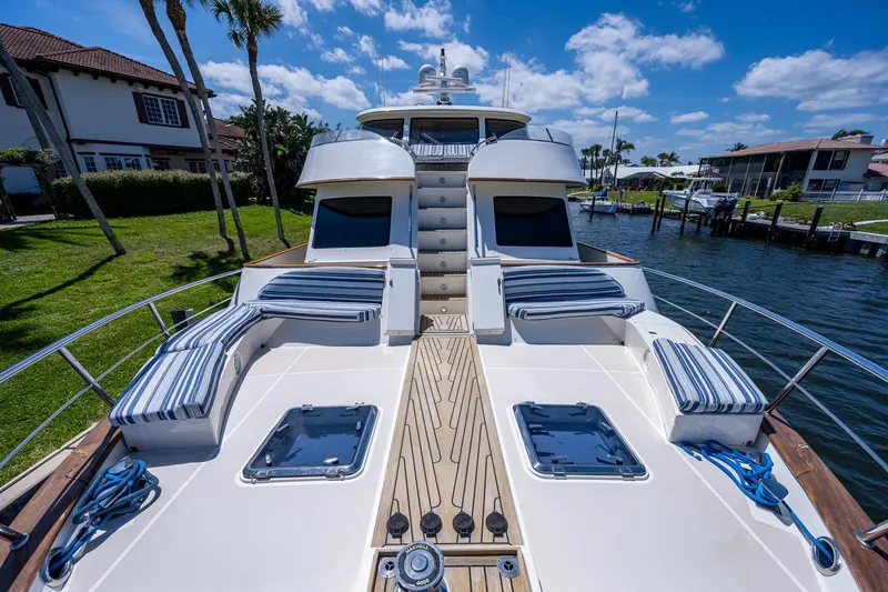 Pivot Yacht Photos Pics 2013 Marlow Explorer Enclosed Bridge (CB) yacht with spacious deck and luxurious seating.