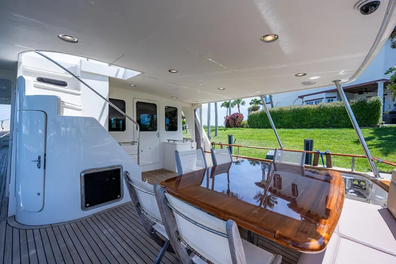 Pivot Yacht Photos Pics 2013 Marlow Explorer Enclosed Bridge CB yacht with outdoor dining area.