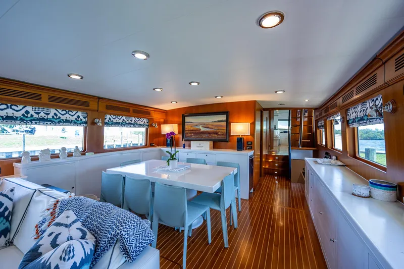 Pivot Yacht Photos Pics Luxurious interior of 2013 Marlow Explorer Enclosed Bridge yacht with modern dining area.