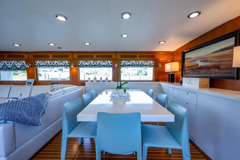Pivot Yacht Photos Pics Luxurious interior of 2013 Marlow Explorer Enclosed Bridge yacht with modern dining area.