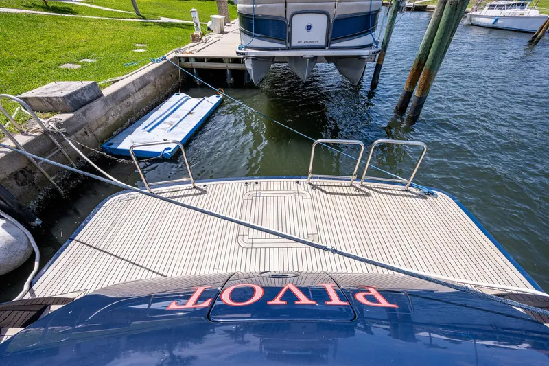 Pivot Yacht Photos Pics 2013 Marlow Explorer Enclosed Bridge (CB) yacht docked at marina.