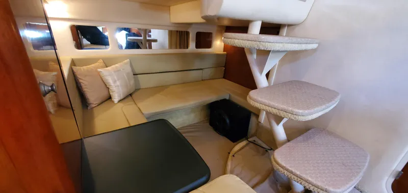 Just Becuz Yacht Photos Pics Interior of 2007 Sea Ray 310 Sundancer with cozy seating and elegant stairs.