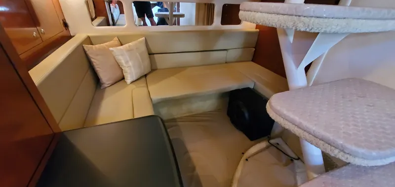 Just Becuz Yacht Photos Pics Interior of 2007 Sea Ray 310 Sundancer with cozy seating and table.