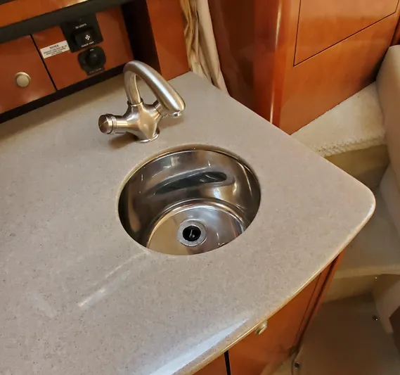 Just Becuz Yacht Photos Pics 2007 Sea Ray 310 Sundancer interior sink with modern faucet and countertop.
