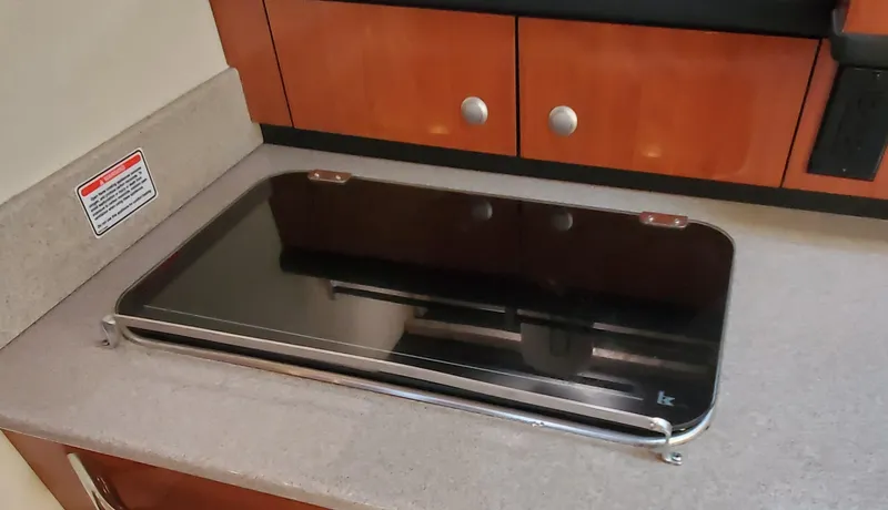 Just Becuz Yacht Photos Pics Built-in stove on 2007 Sea Ray 310 Sundancer yacht kitchen counter.