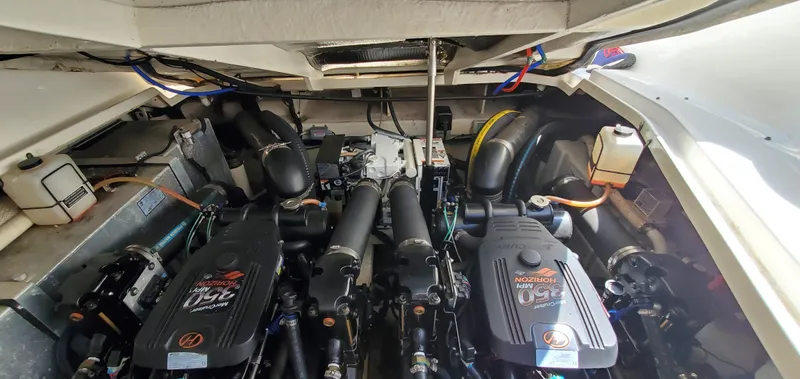Just Becuz Yacht Photos Pics Engine compartment of a 2007 Sea Ray 310 Sundancer boat, showcasing dual engines.