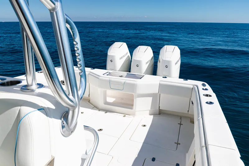  Yacht Photos Pics 2024 SeaVee 390B boat with triple Mercury engines on open ocean.