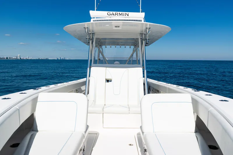  Yacht Photos Pics 2024 SeaVee 390B boat on open ocean, featuring sleek white seating and Garmin equipment.