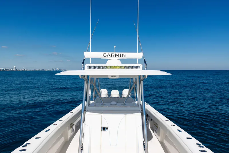  Yacht Photos Pics 2024 SeaVee 390B boat on open ocean with clear blue sky.