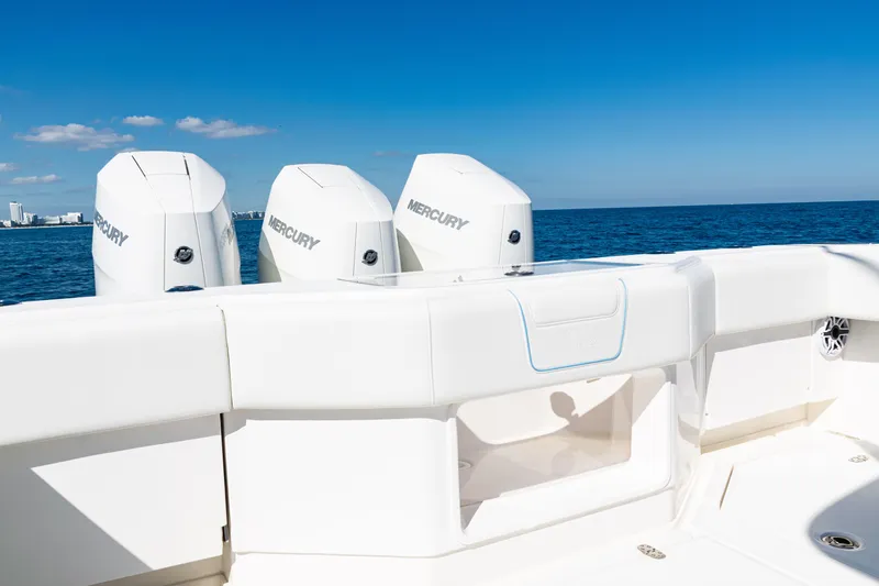  Yacht Photos Pics 2024 SeaVee 390B boat with triple Mercury engines on open ocean.