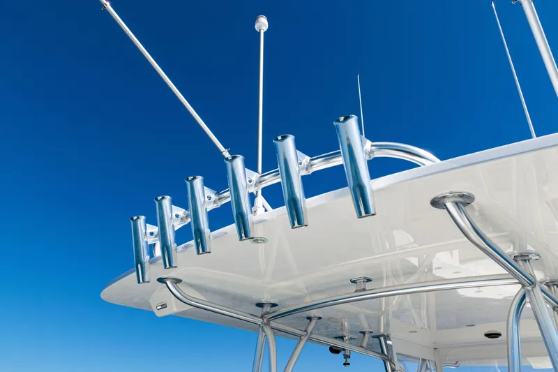  Yacht Photos Pics 2024 SeaVee 390B boat with rod holders against clear blue sky.