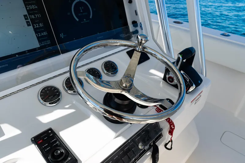  Yacht Photos Pics 2024 SeaVee 390B boat helm with modern controls and navigation displays.