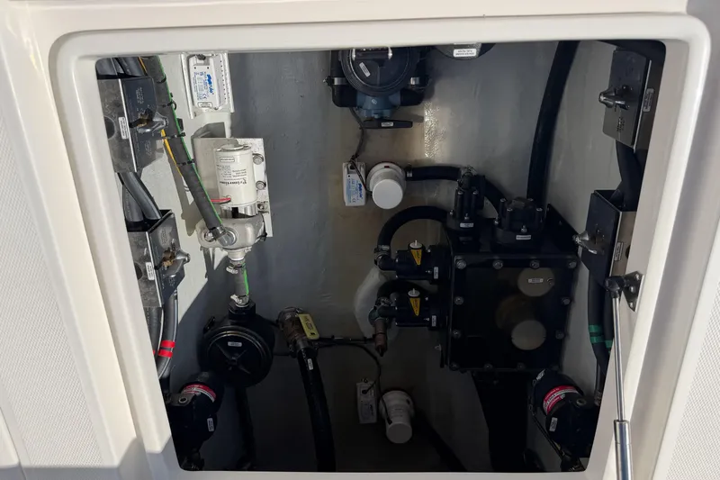  Yacht Photos Pics 2024 SeaVee 390B boat compartment showcasing intricate mechanical components and wiring.