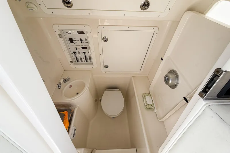 Yacht Photos Pics 2024 SeaVee 390B boat interior bathroom with sink, toilet, and control panel.