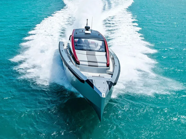 Mana Yacht Photos Pics Futuristic Maori m54 yacht speeding on turquoise waters, 2025 model.
