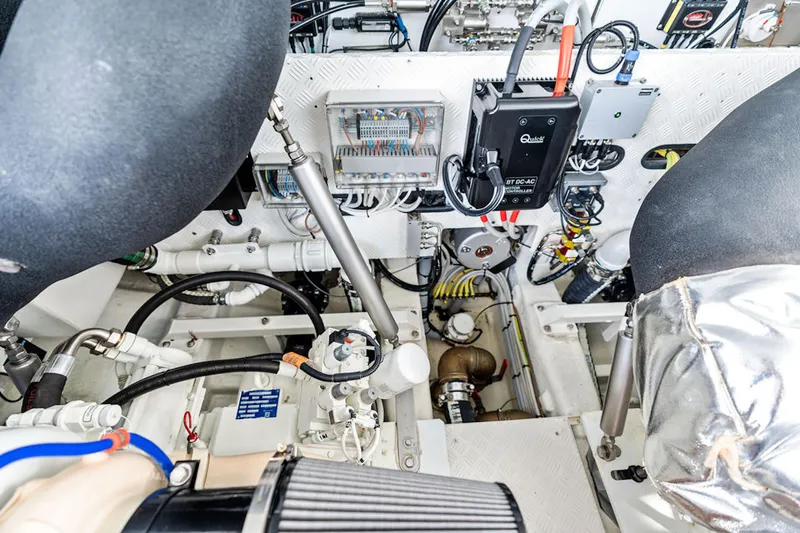Mana Yacht Photos Pics Engine room of a 2025 Maori m54, showcasing complex machinery and wiring.