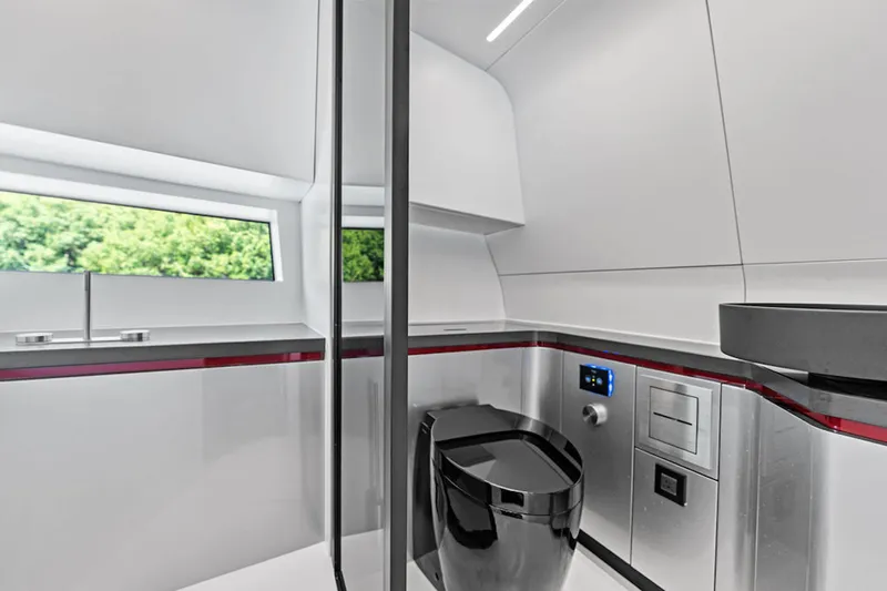 Mana Yacht Photos Pics Luxurious modern bathroom in 2025 Maori m54 yacht, featuring sleek design and advanced amenities.