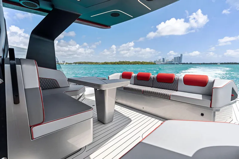 Mana Yacht Photos Pics Luxurious 2025 Maori m54 yacht interior with modern seating, ocean view, and city skyline.