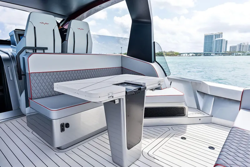 Mana Yacht Photos Pics Luxurious Maori m54 yacht interior, featuring sleek seating and modern table design, 2025 model.