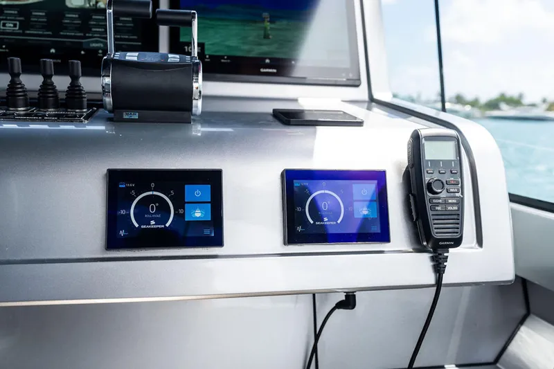 Mana Yacht Photos Pics Control panel of 2025 Maori m54 yacht with digital displays and communication device.