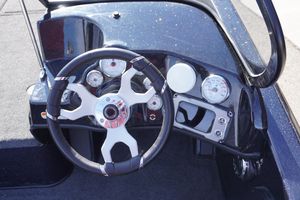 Steering wheel and dashboard of 2026 Nitro ZV19 Sport boat.